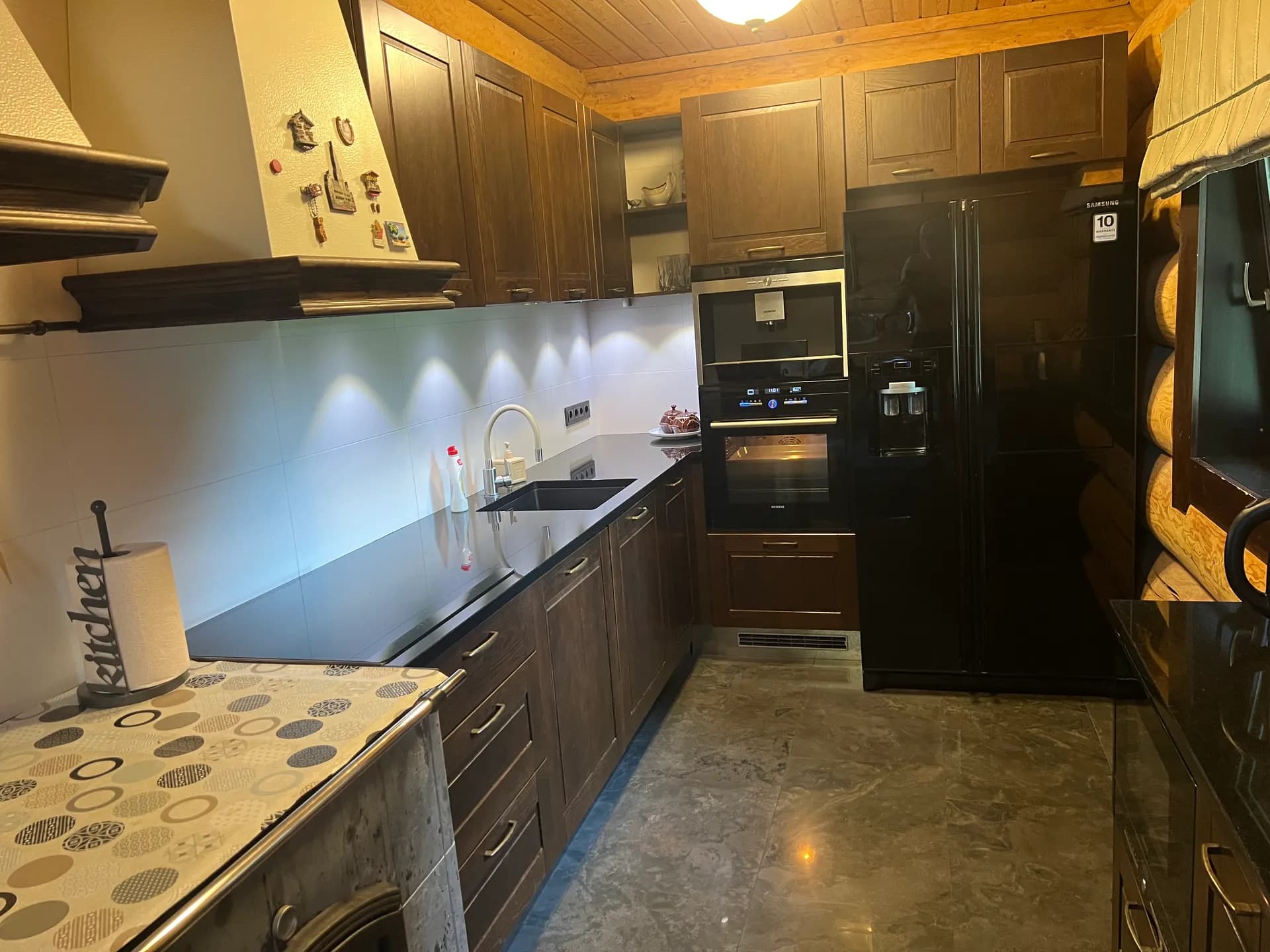 Fully equipped kitchen with dishwasher and fridge